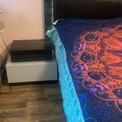 Stylish bed with lighting and two queen-sized bedside tables