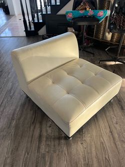 White leather armless chair