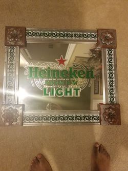 Heiniken light mirror sign