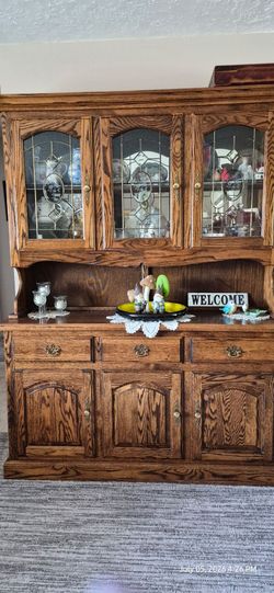 Lighted two peice oak hutch
18" deep, 59" wide, and  77.5" tall