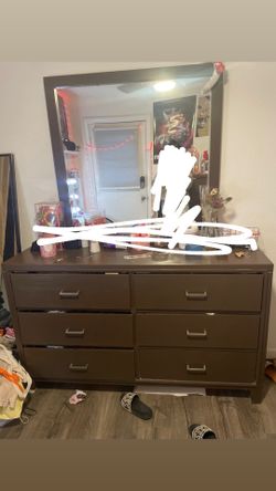 Brown dresser with mirror