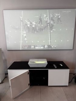 This includes a SIM 2 XTV projector 4K UHD, an Integra DTM 7 amplifier, screen and a sleek storage unit