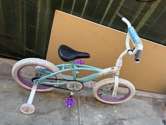 Pink and white girls' bicycle features training wheels and a coaster brake, 12 inch