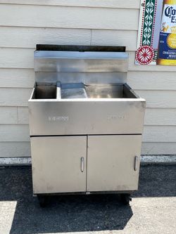 Dean (by Frymaster) Split-Vat or Double-Vat Commercial Gas Floor Fryer on casters.