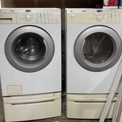 LG Front Load Washer / Electric Dryer With Risers
