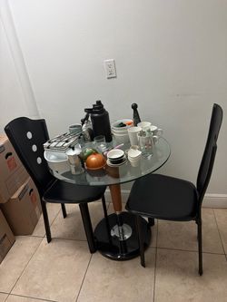 Small glass table and two chairs