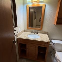 Bathroom Vanity, Mirror, and Cabinet