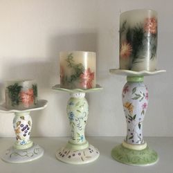 Beautiful candle holders. Hand painted, by Capriware. 5.5” width x 6”, 8” & 10” tall. Beautiful set of 3 pillar candles. 2 are slightly burned, one