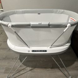 Fisher-Price Luminate Bassinet Infant Bedside Crib With Sound Detection Plus Lights And Music.