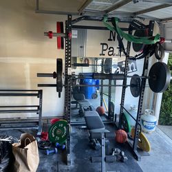 Squat rack with weights and accessories