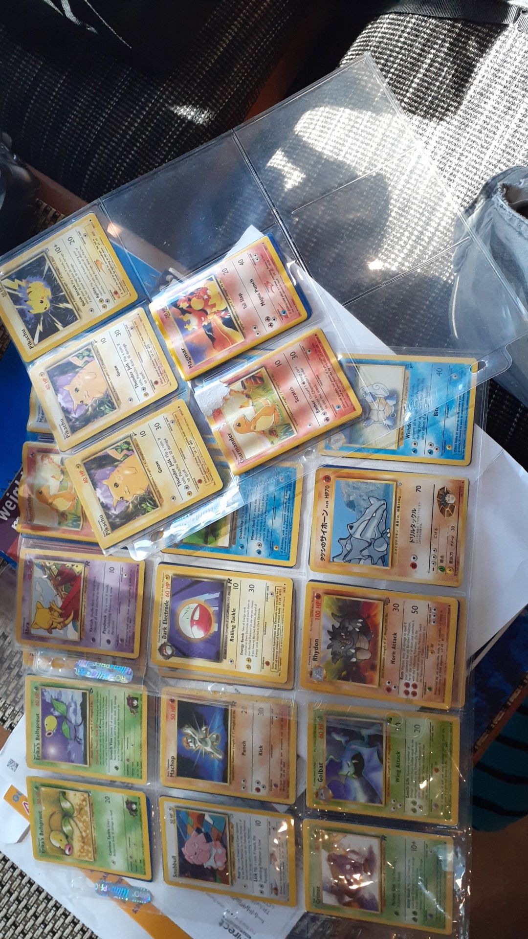 Over 40 Pokemon cards with sleeves, and7 Pikachus.