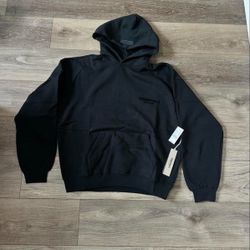 Black Fear of God Essentials hoodie — Stretch Limo.  •