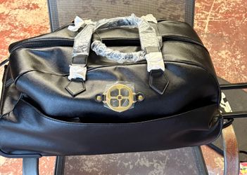 Elegant Black IMAN Rolling Duffle Bag Luggage
