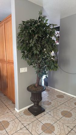 Bonita base con planta artificial