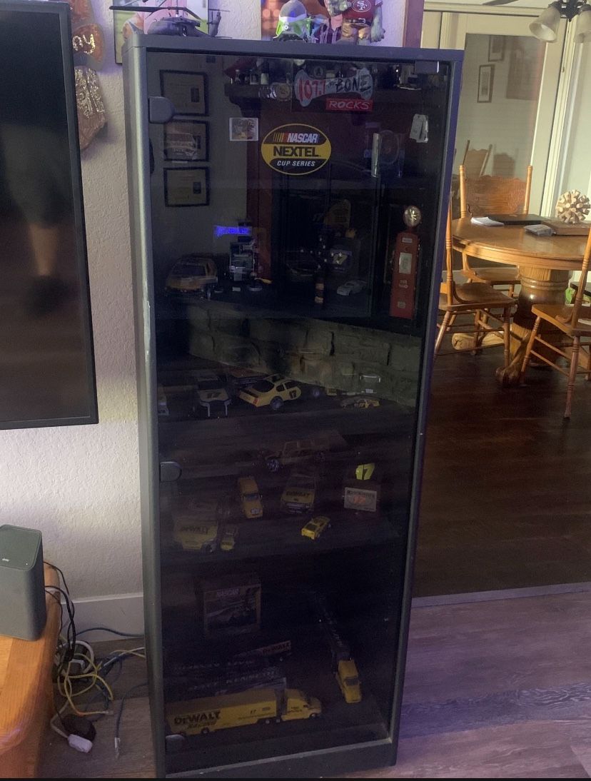 Black Cabinet On Wheels.    Glass Door. 