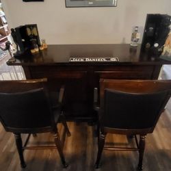 wood bar with 2 barstools
