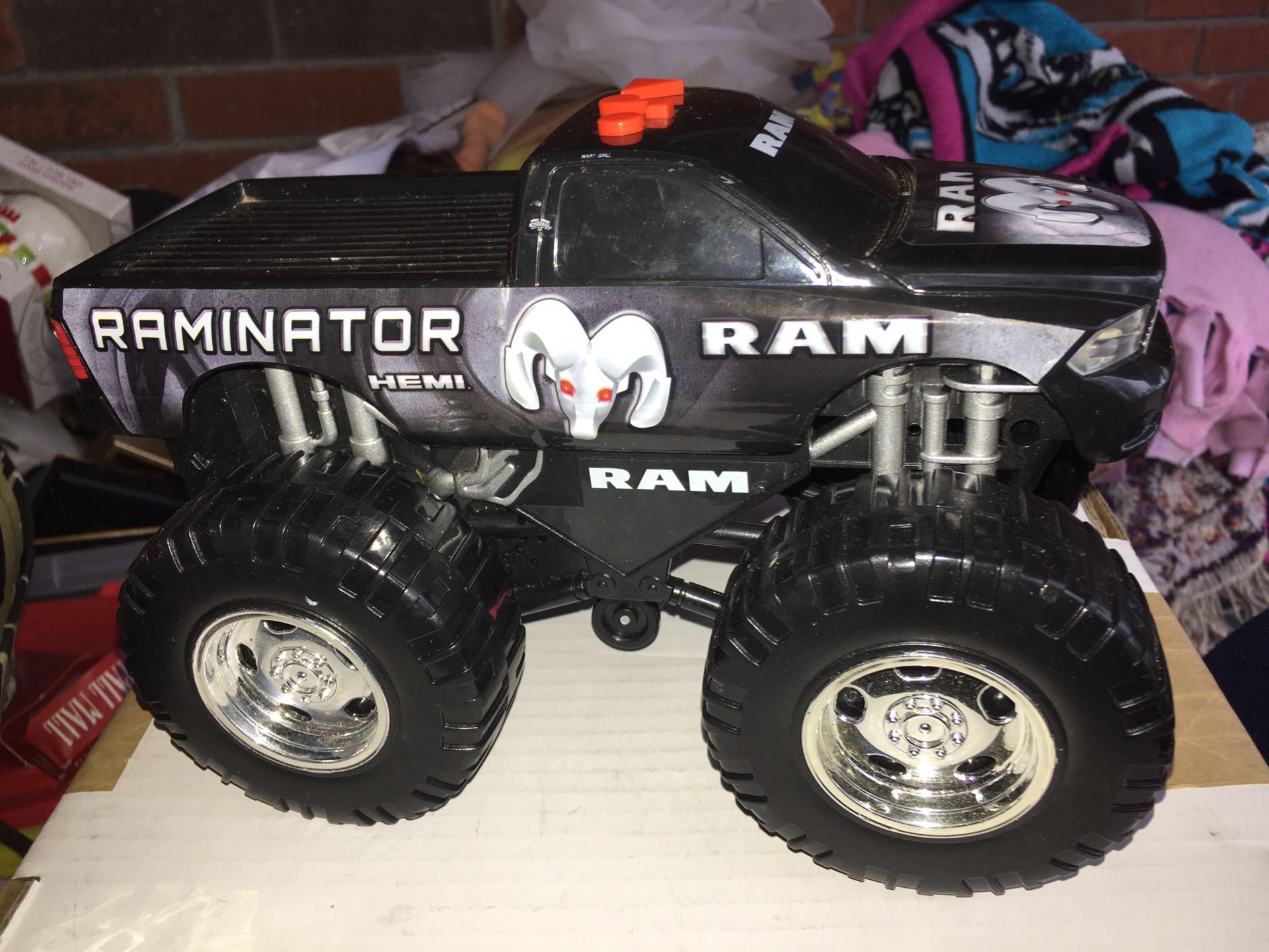 ~Dodge Ram monster truck~pops wheelies makes different engine noises and lights up
