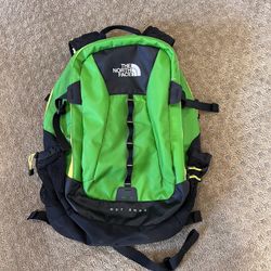 The North Face Base Camp Hot Shot Backpack in Green, black and yellow, waterproof fabric
