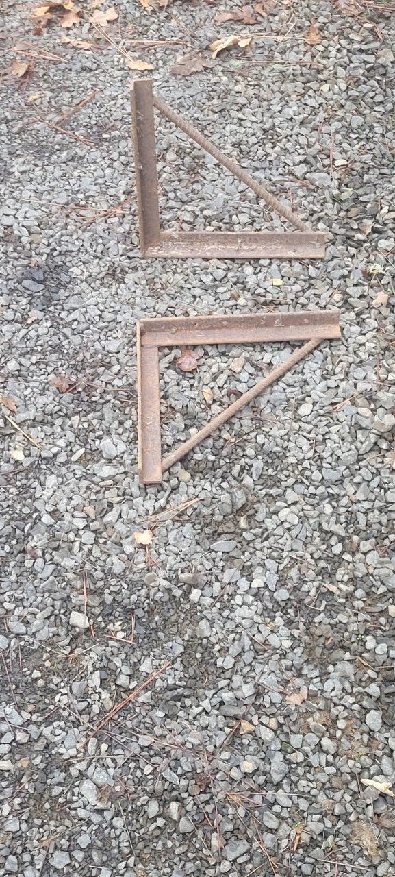 Concrete forming brackets and construction fencing