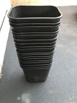 Small black garbage cans