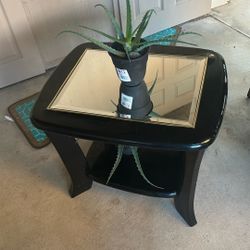 A  Mirrored Top End Table With Bottom Tier