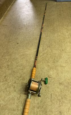 Penn 65 Long Beach Reel with vintage wooden handle fishing pole