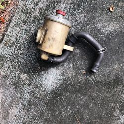 Power steering retainer and fuel pump