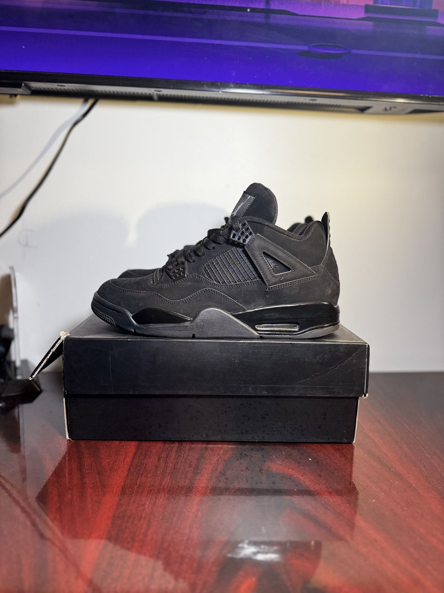 Black cat Jordan 4’s