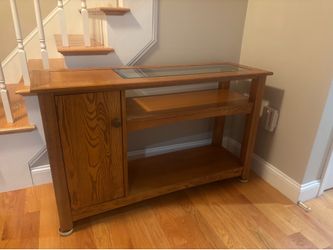 Sofa table with glass top and cabinet