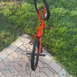 Orange mongoose bike with Pegs 