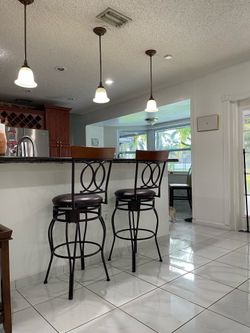 Pair of Swivel Metal Bar Stools w/ Wood Backrest