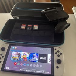 Nintendo Switch OLED + 4 Games