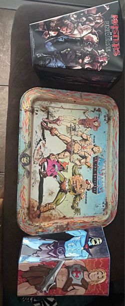 Masters of the universe serving tray and two popcorn buckets.