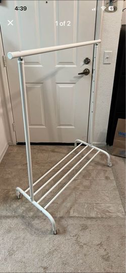 Rolling clothing rack with bottom