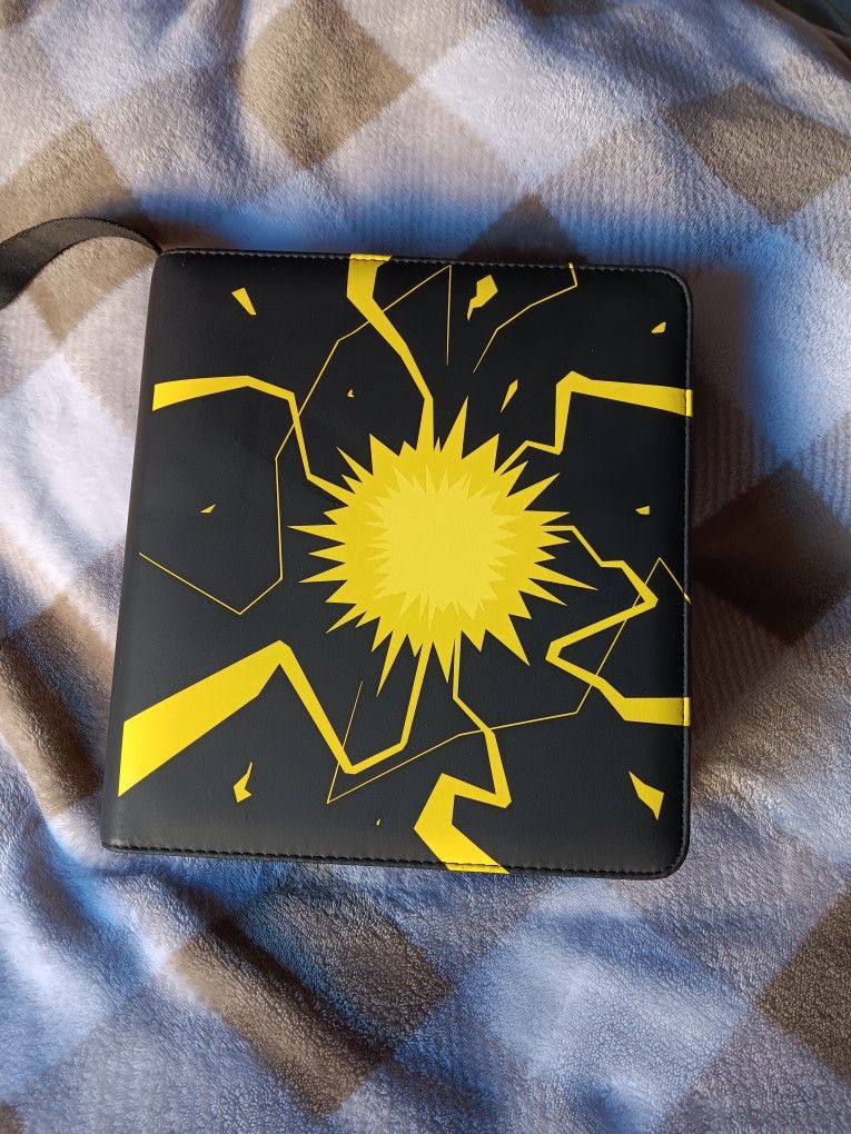 Very Nice Trading Card Binder For Sale. Has A "Thunderbolt " Design. Lightly Used, In Good Condition.