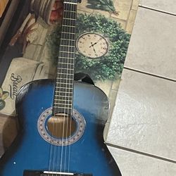 A Guitar For Men And Children Comes With A Strap And A Case For It 