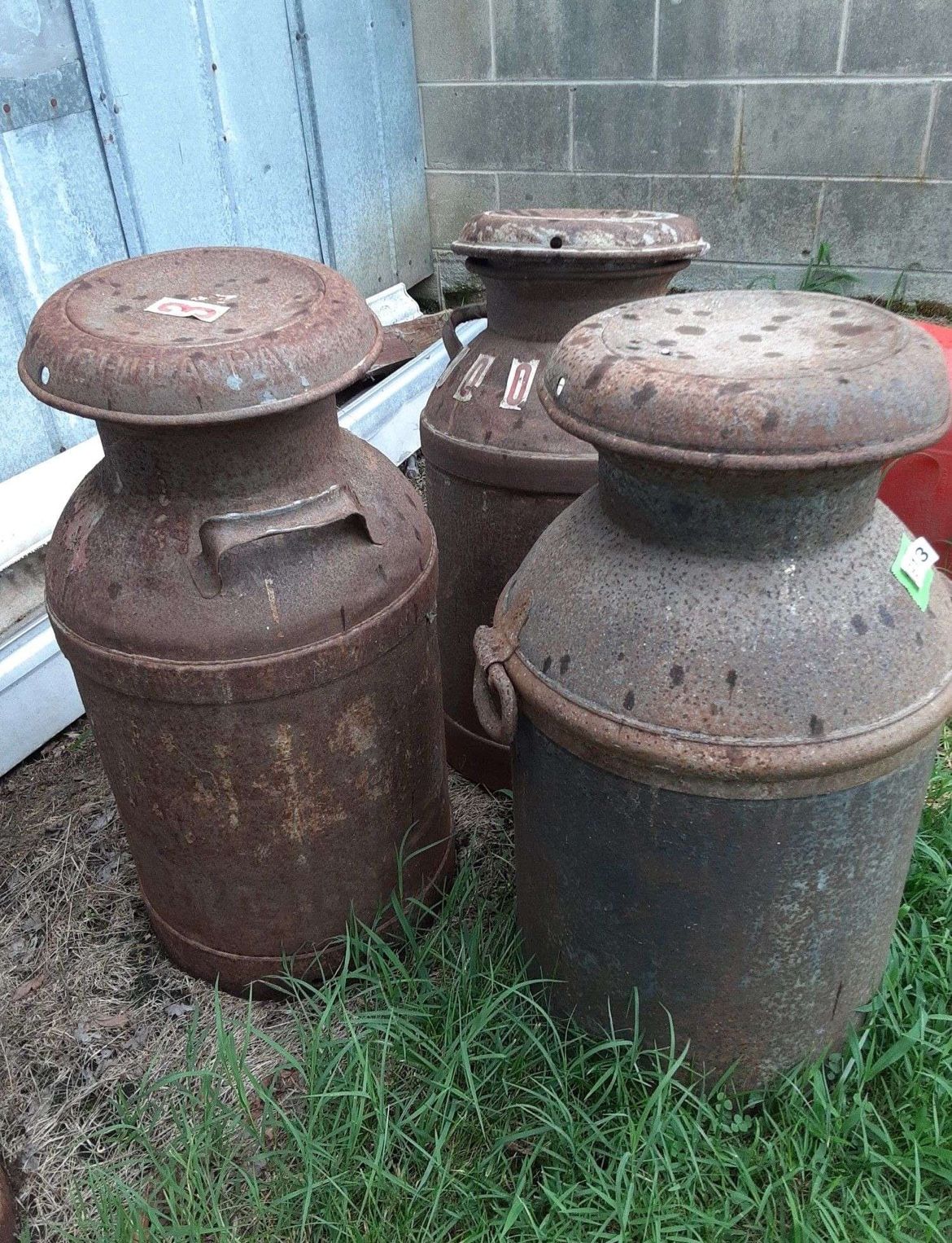 Antique metal milk jug with lid