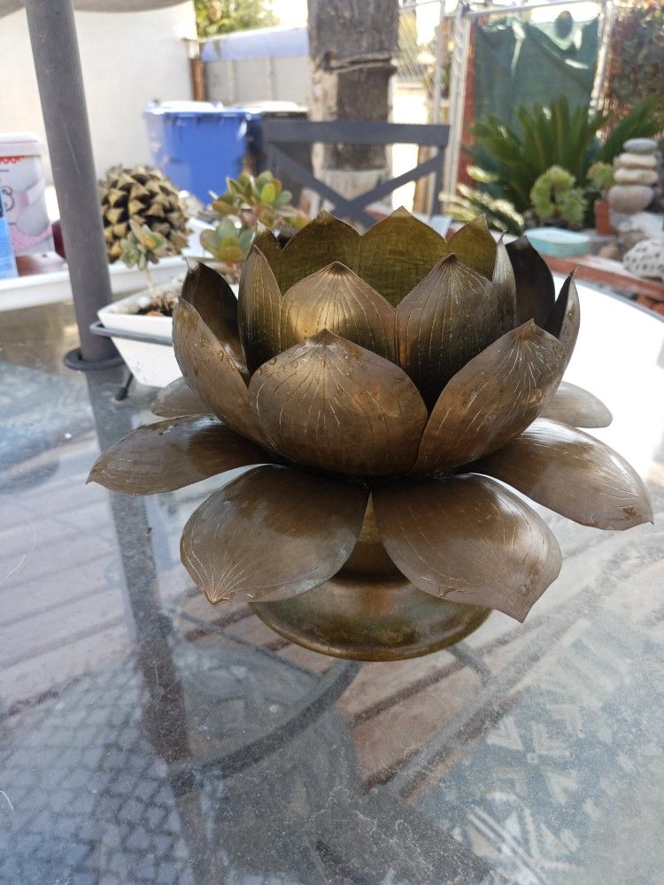 One copper lotus candlestick