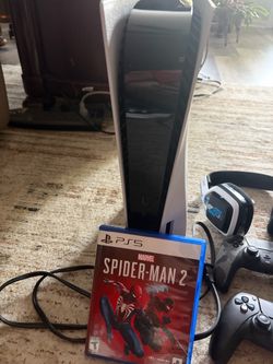 PS5 with controllers and headset