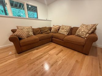 Sectional couch length 104” x  104” and 41” wide/deep and back height 32”
