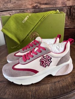 Tory Burch Good Luck Trainers in New Cream, Taupe, and Tory Red.