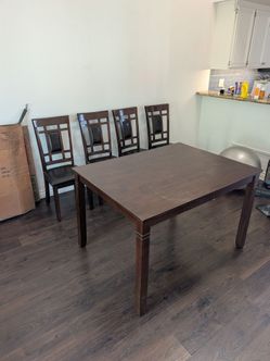 Brown Medium sized wood kitchen table