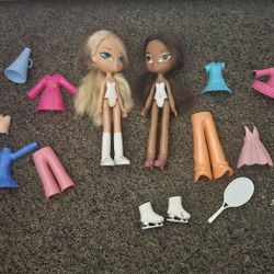 2 dolls with clothes 