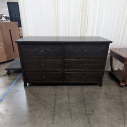 Dark Brown Six-Drawer Dresser with Ornate Carvings