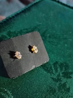 Marquise-cut genuine diamond stud earrings in 14k yellow gold