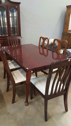Dining table and six chairs in dark cherry and cream covered upholstery