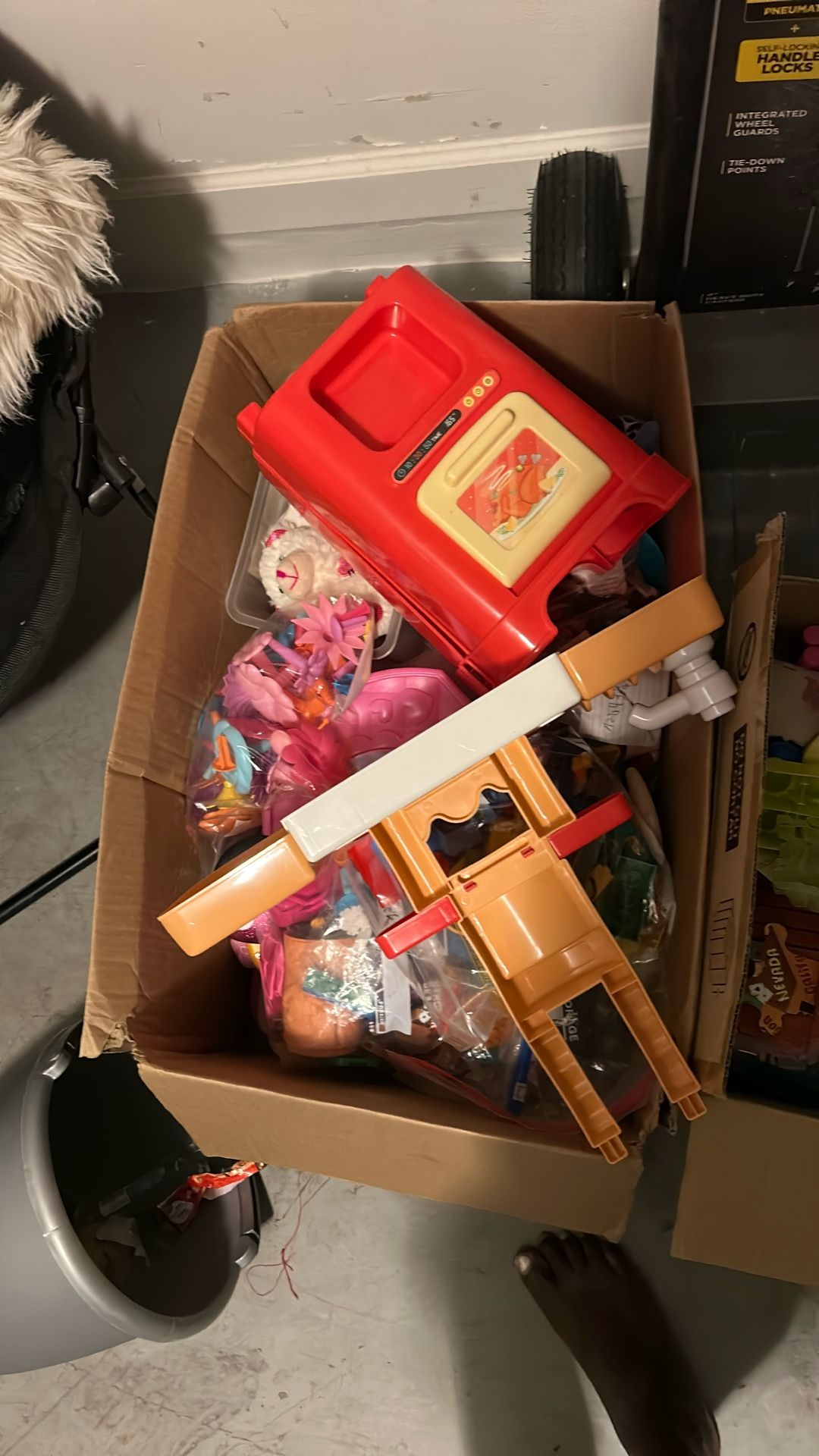 Two Boxes Of Some Random Toys And Kids Book
