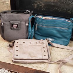 Three small purses in various colors