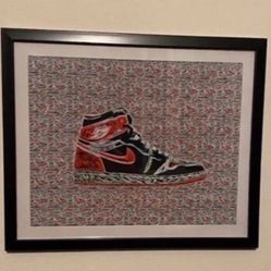 Custom art piece of red and black retro nike air Jordan 1 in black frmae