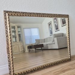 Gold ornate hanging mirror